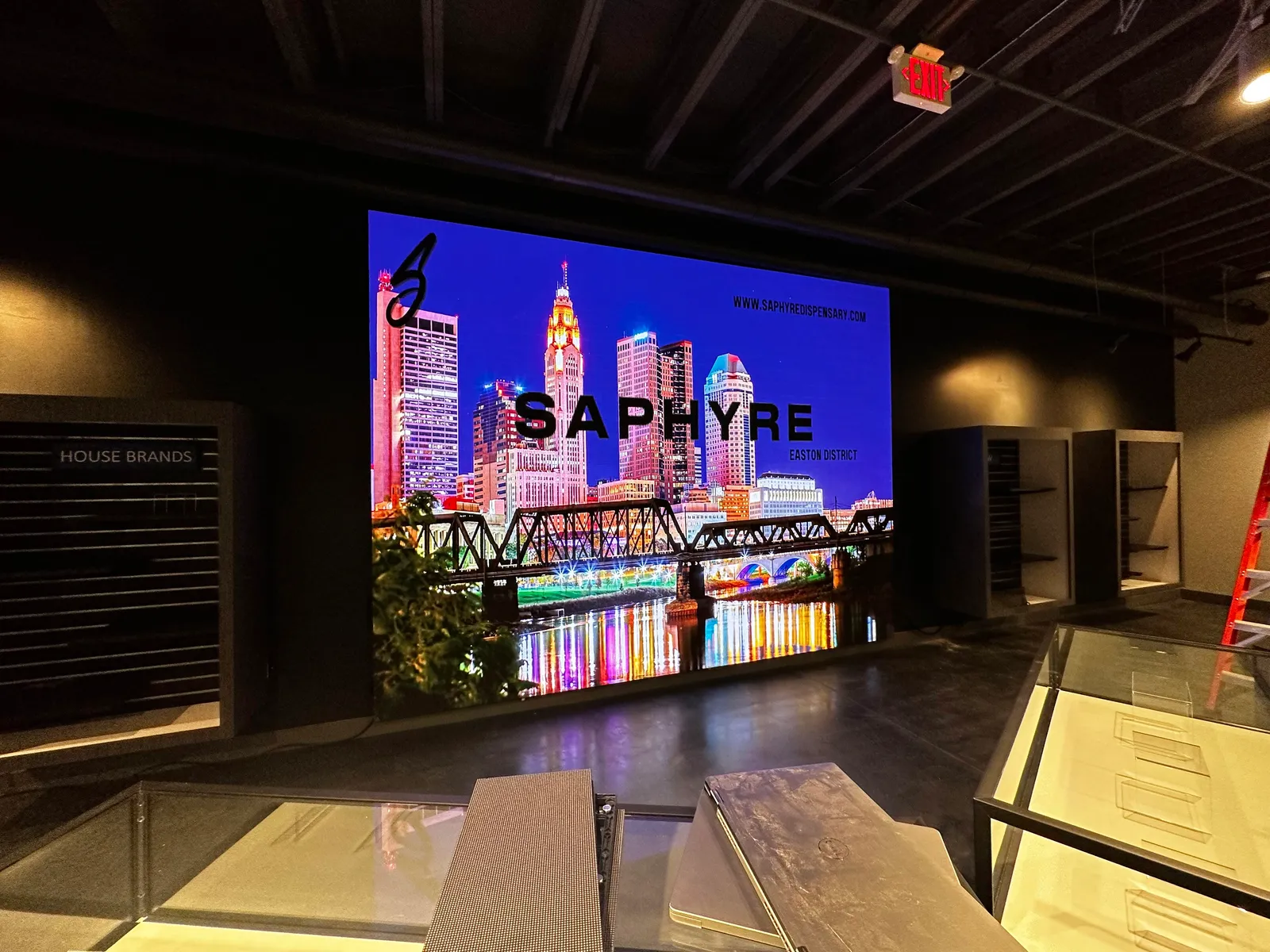 Video wall showing a city skyline at night in a dark showroom